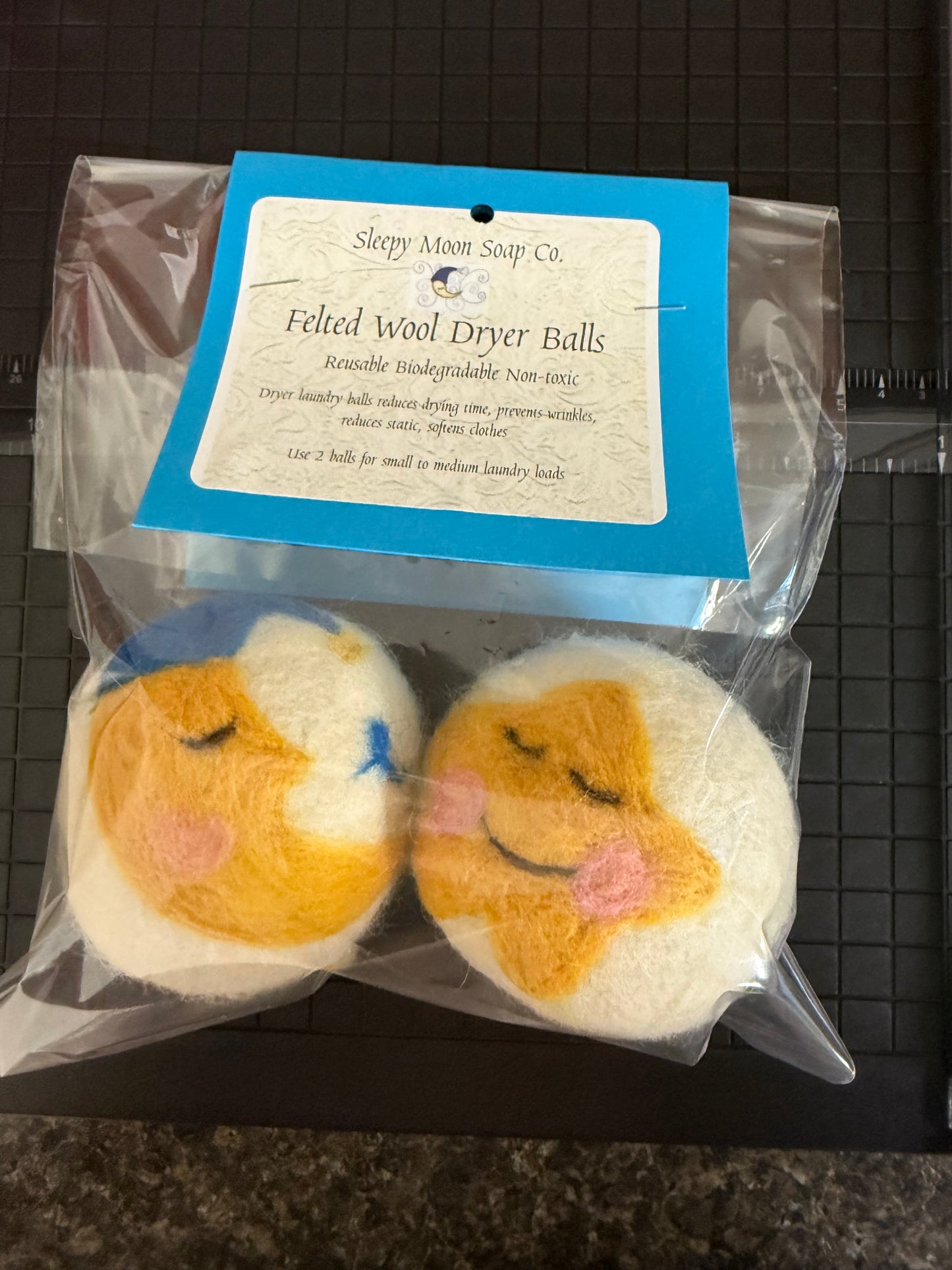 Felted wool laundry dryer balls: sleepy moon and sun
